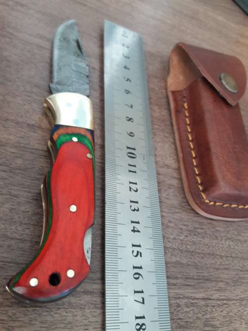 Handmade Damascus steel folding knife with WOODEN handle scales.
