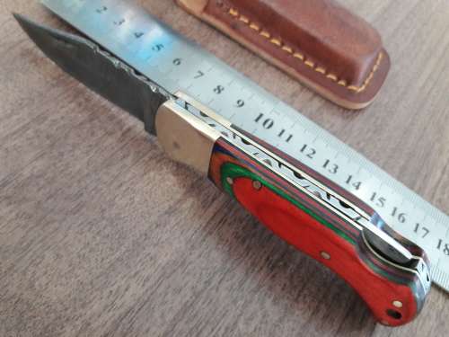 Handmade Damascus steel folding knife with WOODEN handle scales.