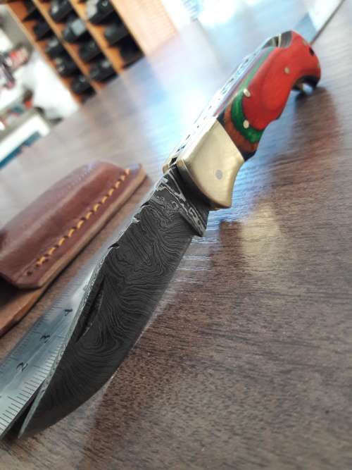Handmade Damascus steel folding knife with WOODEN handle scales.