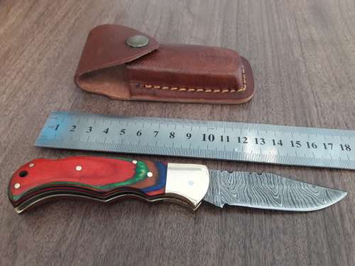 Handmade Damascus steel folding knife with WOODEN handle scales.
