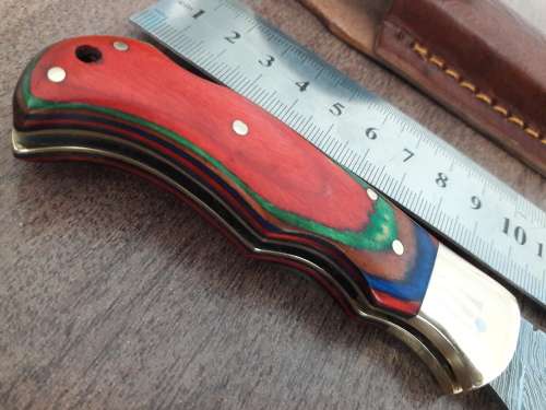 Handmade Damascus steel folding knife with WOODEN handle scales.