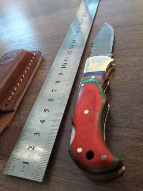 Handmade Damascus steel folding knife with WOODEN handle scales.