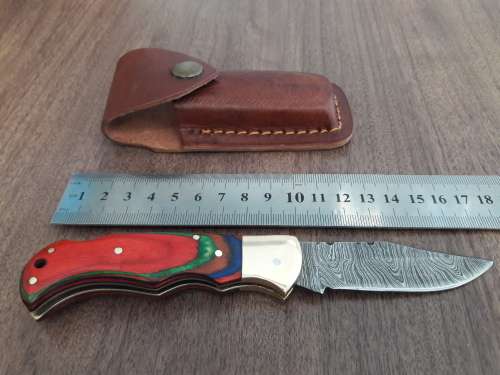 Handmade Damascus steel folding knife with WOODEN handle scales.