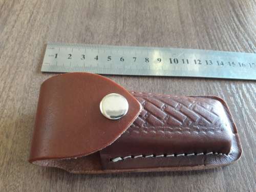 Handmade Damascus steel folding knife with Resin handle scales.