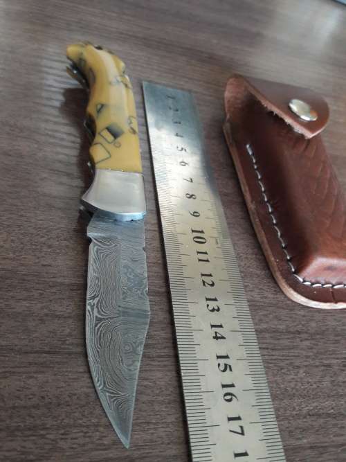 Handmade Damascus steel folding knife with Resin handle scales.