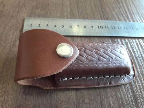 Handmade Damascus steel folding knife with Camel Bone handle scales.