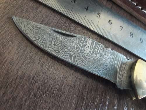 Handmade Damascus steel folding knife with Burnt Camel Bone handle scales.