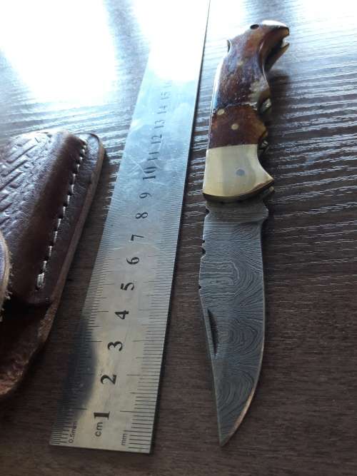 Handmade Damascus steel folding knife with Burnt Camel Bone handle scales.