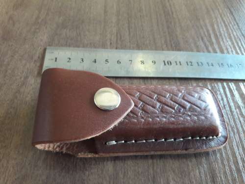 Handmade Damascus steel folding knife with Burnt Camel Bone handle scales.