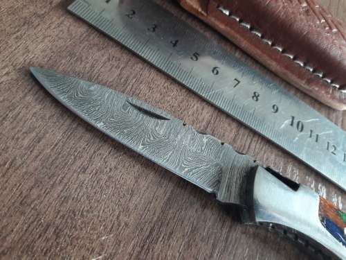 Handmade Damascus steel folding knife with Wooden handle scales.