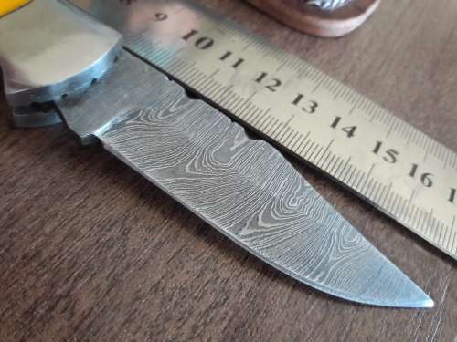 Handmade Damascus steel folding knife with Resin handle scales.