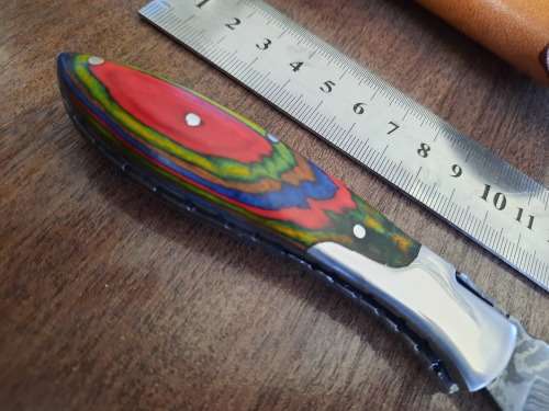 Handmade Damascus steel folding knife with Wooden handle scales.