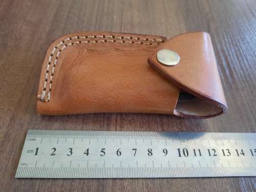 Handmade Damascus steel folding knife with MICARTA handle scales.