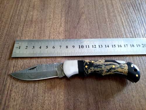 Handmade Damascus steel folding knife with Bull Horn Handle. Elephant picture engraved. NEW STOCK !