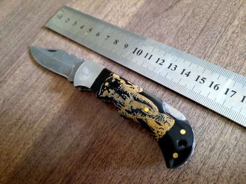 Handmade Damascus steel folding knife with Bull Horn Handle. Elephant picture engraved. NEW STOCK !