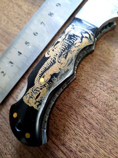 Handmade Damascus steel folding knife with Bull Horn Handle. Elephant picture engraved. NEW STOCK !