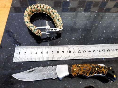 Handmade Damascus steel folding knife with Bull Horn handle scales. FREE Bracelet