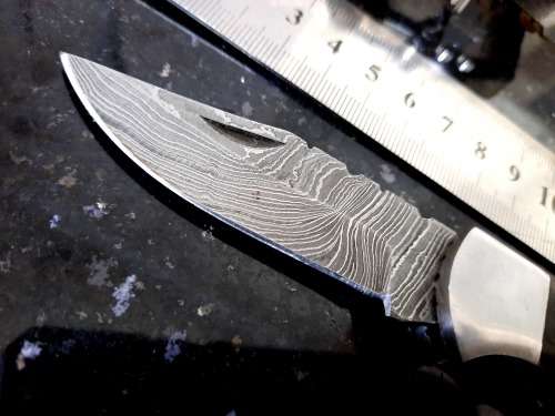 Handmade Damascus steel folding knife with Bull Horn handle scales. FREE Bracelet