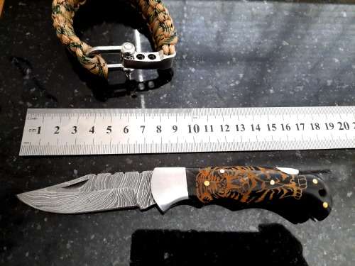 Handmade Damascus steel folding knife with Bull Horn handle scales. FREE Bracelet