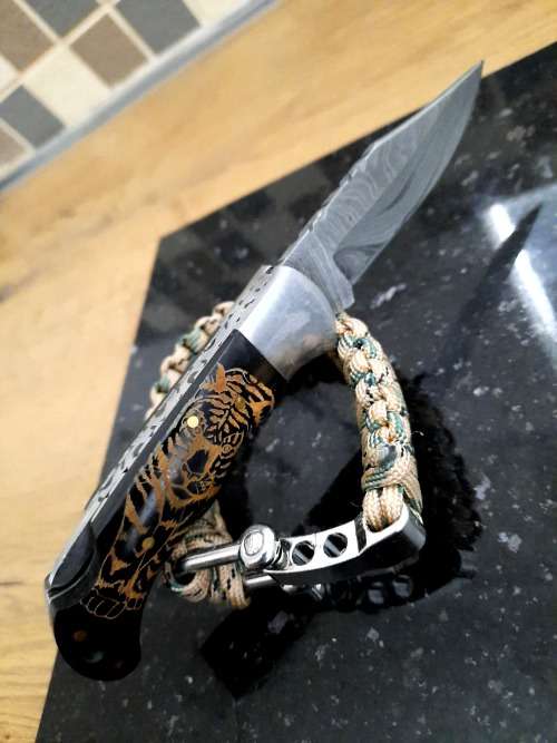 Handmade Damascus steel folding knife with Bull Horn handle scales. FREE Bracelet