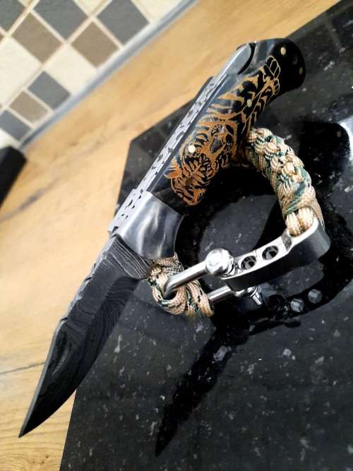 Handmade Damascus steel folding knife with Bull Horn handle scales. FREE Bracelet