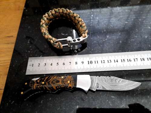 Handmade Damascus steel folding knife with Bull Horn handle scales. FREE Bracelet