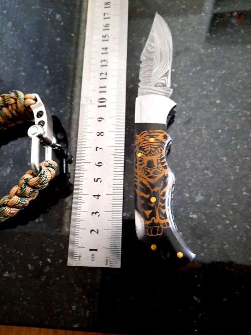 Handmade Damascus steel folding knife with Bull Horn handle scales. FREE Bracelet