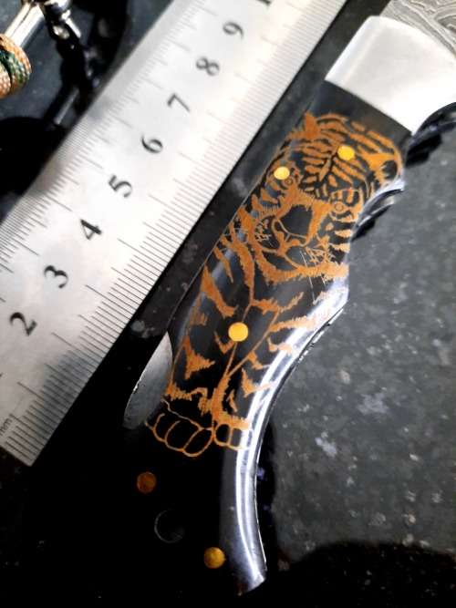 Handmade Damascus steel folding knife with Bull Horn handle scales. FREE Bracelet