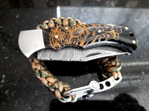 Handmade Damascus steel folding knife with Bull Horn handle scales. FREE Bracelet