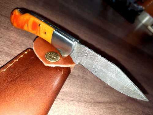 Handmade Damascus steel folding knife with Epoxy Resin handle scales. Crazy R1 start, no reserve.
