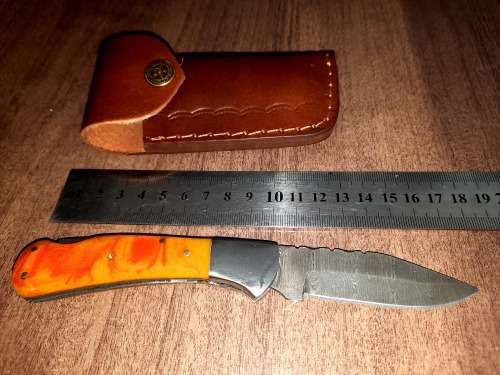 Handmade Damascus steel folding knife with Epoxy Resin handle scales. Crazy R1 start, no reserve.