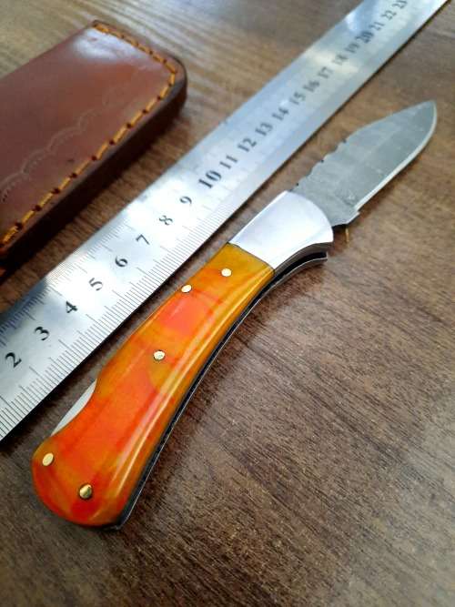 Handmade Damascus steel folding knife with Epoxy Resin handle scales. Crazy R1 start, no reserve.