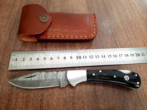 Handmade Damascus steel folding knife with Bull Horn Handle. NEW STOCK !!