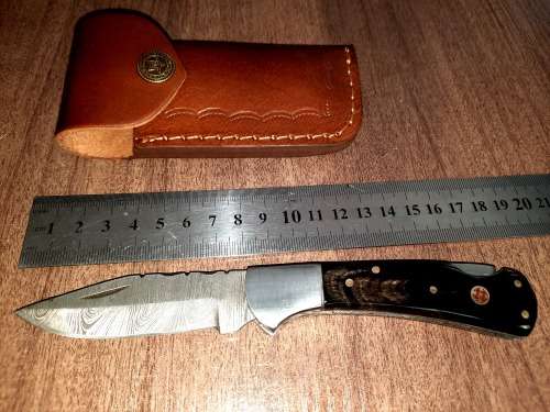 Handmade Damascus steel folding knife with Bull Horn Handle. NEW STOCK !!