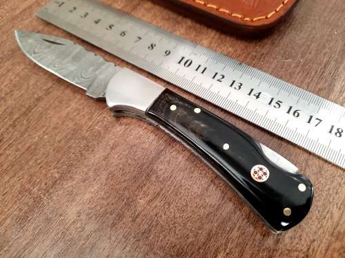 Handmade Damascus steel folding knife with Bull Horn Handle. NEW STOCK !!