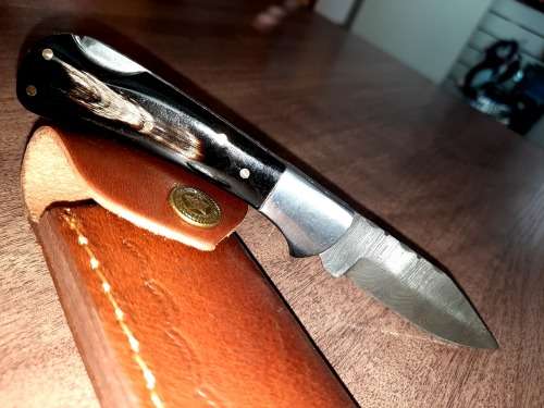 Handmade Damascus steel folding knife with Bull Horn Handle. NEW STOCK !!