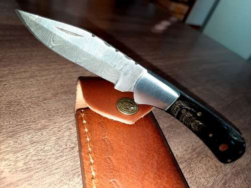 Handmade Damascus steel folding knife with Bull Horn Handle. NEW STOCK !!
