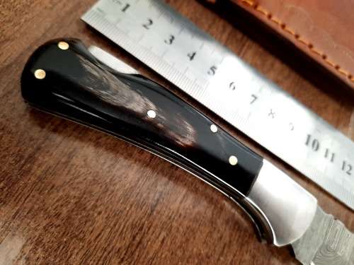 Handmade Damascus steel folding knife with Bull Horn Handle. NEW STOCK !!