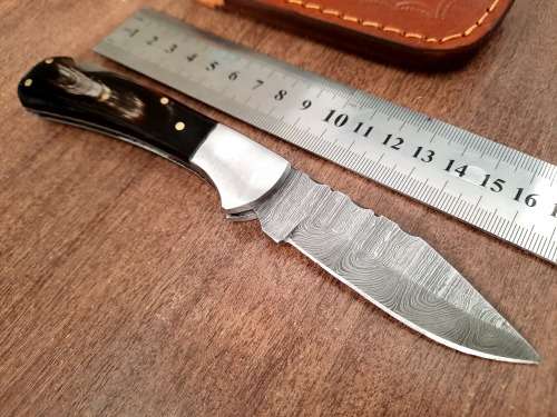 Handmade Damascus steel folding knife with Bull Horn Handle. NEW STOCK !!
