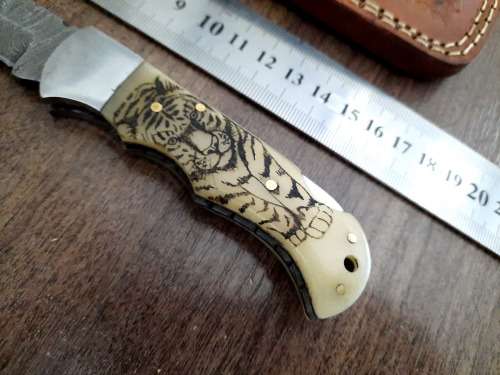 Handmade Damascus steel folding knife w Camel Bone Handle Scales. Leather pouch is FREE.