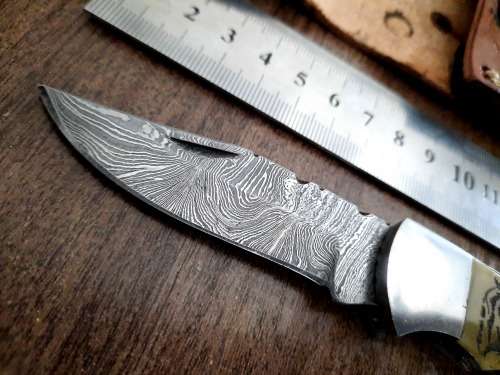 Handmade Damascus steel folding knife w Camel Bone Handle Scales. Leather pouch is FREE.