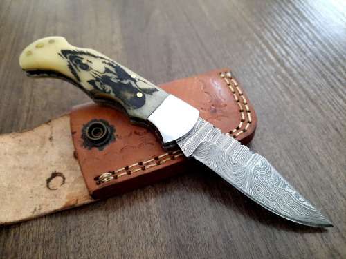 Handmade Damascus steel folding knife w Camel Bone Handle Scales. Leather pouch is FREE.