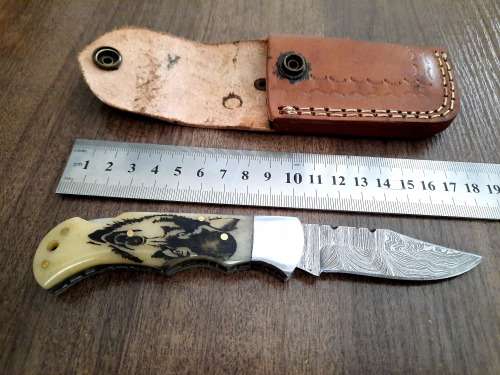 Handmade Damascus steel folding knife w Camel Bone Handle Scales. Leather pouch is FREE.