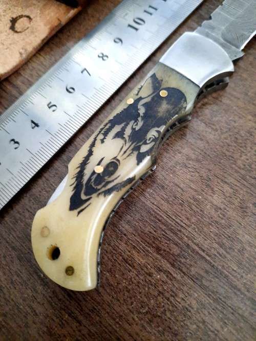 Handmade Damascus steel folding knife w Camel Bone Handle Scales. Leather pouch is FREE.