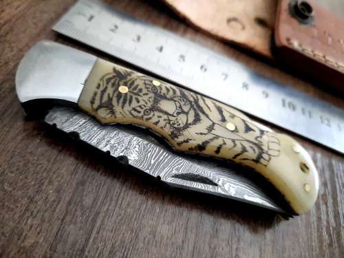 Handmade Damascus steel folding knife w Camel Bone Handle Scales. Leather pouch is FREE.