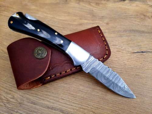 Handmade Damascus steel folding knife w  Bull Horn Handle Scales. New stock !!