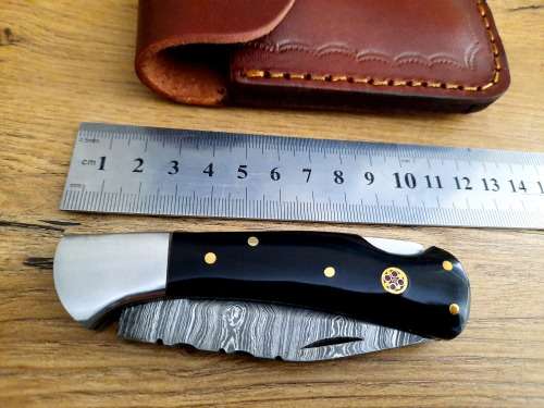 Handmade Damascus steel folding knife w  Bull Horn Handle Scales. New stock !!