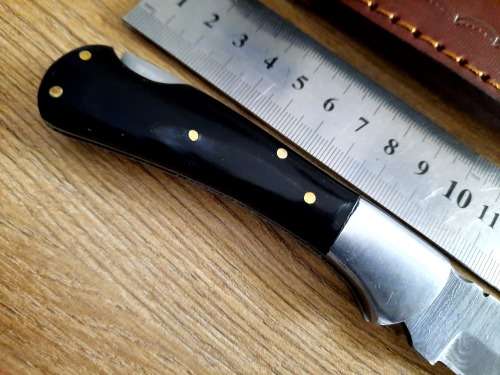 Handmade Damascus steel folding knife w  Bull Horn Handle Scales. New stock !!