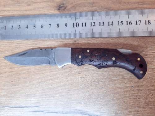 Handmade Damascus steel folding knife w Wooden Handle Scales. Pouch in bad shape, see pictures.