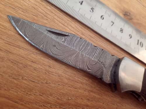 Handmade Damascus steel folding knife w Wooden Handle Scales. Pouch in bad shape, see pictures.